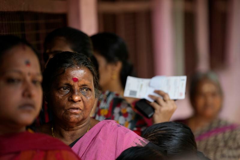 People queue up to vote during the second round of voting in the six-week-long national election near Palakkad, in Indian southern state of Kerala, Friday, April 26, 2024. (AP Photo/Manish Swarup)