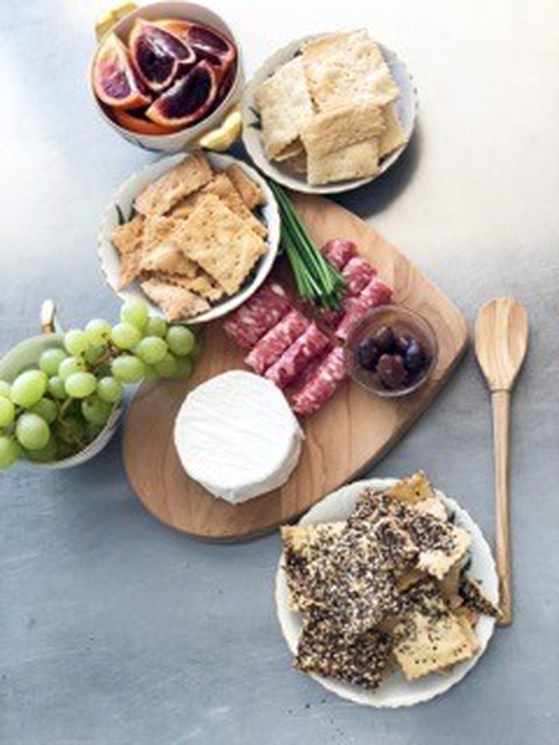  This cheese and charcuterie board features all three varieties of Georgia Sourdough crackers. /Jr Marranci