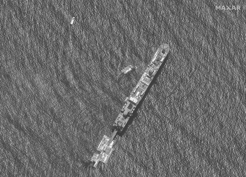 This image provided by Maxar Technologies, shows an April 29, 2024, aerial view of USNS Roy P. Benavidez and floating dock sections during construction of the U.S. military's floating dock that is being assembled offshore of Gaza. The dock and floating pier will be part of the Joint Logistics Over the Shore (JLOTS) system that will help deliver humanitarian aid to Gaza,. (Satellite image ©2024 Maxar Technologies via AP)