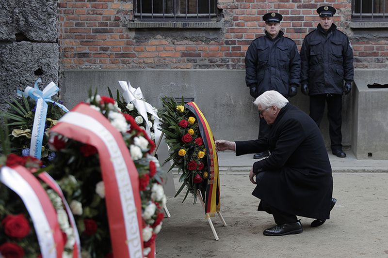Germany's President Frank-Walter Steinmeier lays a wreath Monday at the Death Wall at the Auschwitz Nazi death camp in Oswiecim, Poland.