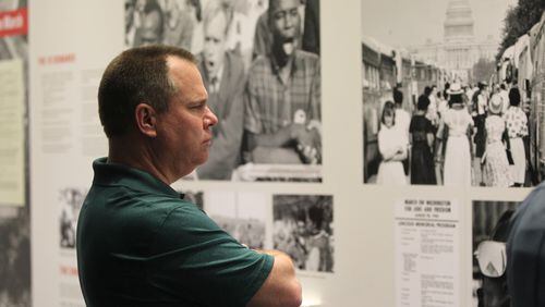 February 14, 2017, Atlanta, Georgia - Gwinnett County Commissioner Tommy Hunter walks through the civil rights exhibit at the National Center for Civil and Human Rights in Atlanta, Georgia, on Tuesday, February 14, 2017. (HENRY TAYLOR / HENRY.TAYLOR@AJC.COM)