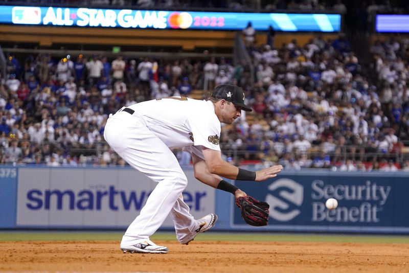 National League third baseman Austin Riley, of the Atlanta Braves, fields a groundout by American League's designated hitter J.D. Martinez, of the Boston Red Sox, during the ninth inning of the MLB All-Star baseball game, Tuesday, July 19, 2022, in Los Angeles. (AP Photo/Mark J. Terrill)