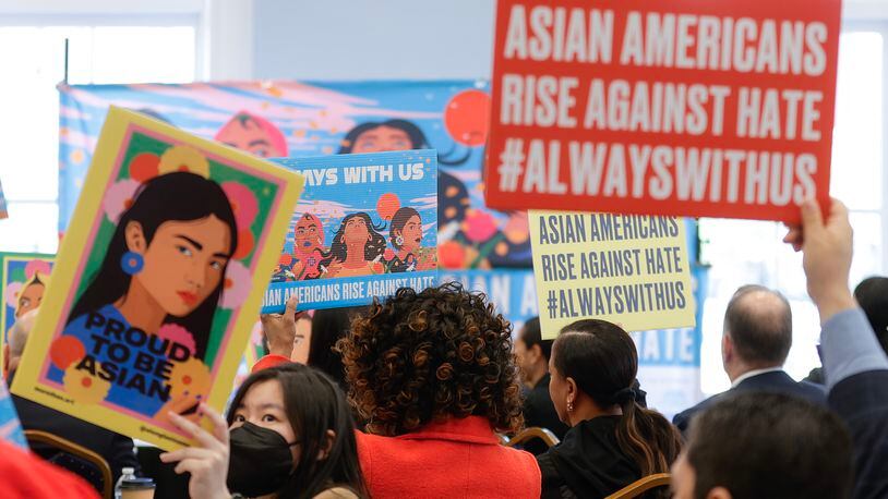 Members of the Asian community and supporters hold up signs  Asian American Rise Against Hate event on Thursday, March 16, 2023. March 16 marks the two year anniversary of the Atlanta spa shootings that took the lives of eight people including six Asian Americans. (Natrice Miller/ natrice.miller@ajc.com)