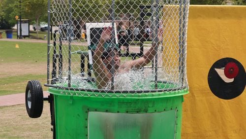 Jason Manzanarez, a junior business management major at Kennesaw State University, takes the plunge during Pi Kappa Phi's "Dunk-a-Brother" event.
