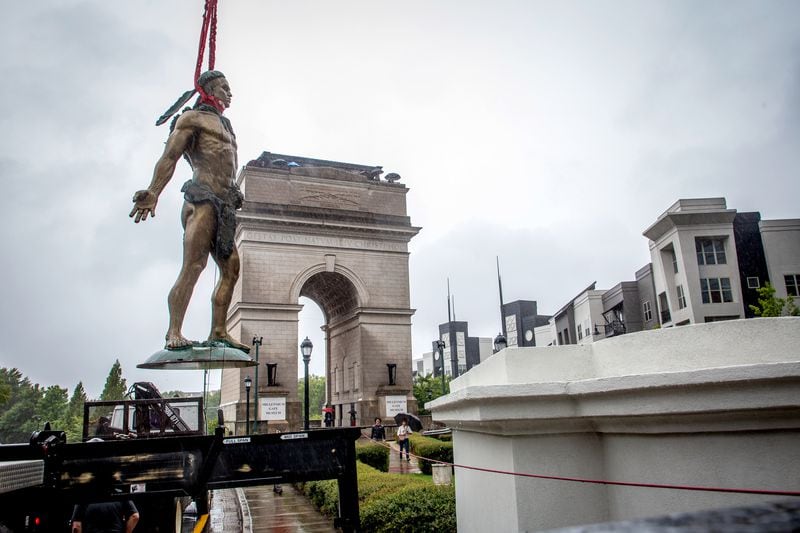   Workers temporarily install the statue of Tomochichi, chief of the Yamacraw, at the Millennium Gate Museum on 17th St. Monday, September 20, 2021.  STEVE SCHAEFER FOR THE ATLANTA JOURNAL-CONSTITUTION