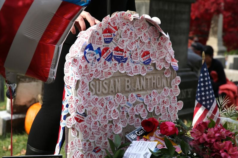 Women who voted in the 2016 election put stickers on the grave of Susan B. Anthony at Mt. Hope Cemetery in Rochester, New York.