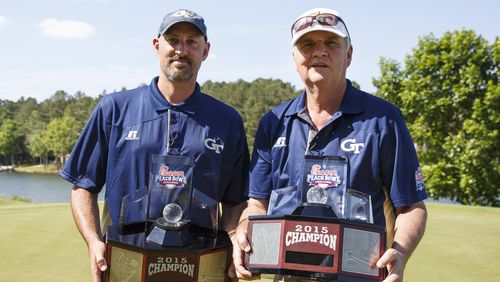 during the 2015 Chick-fil-A Peach Bowl Challenge Round on the Oconee Course at Reynolds Plantation on Tuesday, April 28, 2015. (Chick-fil-A Peach Bowl/Abell Images/Paul Abell) A familiar pose: Georgia Tech coach Paul Johnson and former Tech basketball star Jon Barry with the championship trophy from the Chick-fil-A Peach Bowl Challenge. (Chick-fil-A Peach Bowl/Abell Images/Paul Abell)