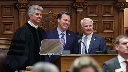 Lt. Gov. Burt Jones, center, and House Speaker Jon Burns announced the creation of a blue-ribbon committee to examine the state's licensing process for businesses. (Natrice Miller/natrice.miller@ajc.com)