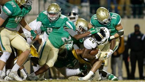 Buford defeated Carrollton, 34-27, in the quarterfinal to advance in Class AAAAA. (Jason Getz/Special to AJC)