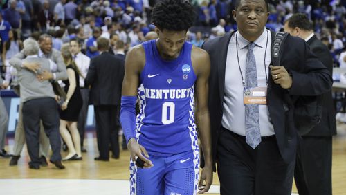 Kentucky guard De'Aaron Fox (0) leaves the court after Kentucky lost to North Carolina 75-73 in the South Regional final game in the NCAA college basketball tournament Sunday, March 26, 2017, in Memphis, Tenn. (AP Photo/Mark Humphrey)