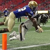 Colquitt County wide receiver Lemeke Brockington (17) makes a touchdown catch against McEachern defensive back Ja'Leak Perry (12) in the second half during the Corky Kell Classic game Saturday, Aug. 18, 2018 at Mercedes-Benz Stadium in Atlanta. Colquitt County won, 41-7.
