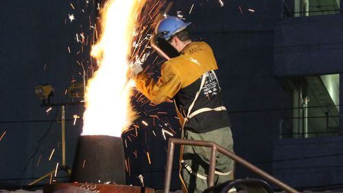 Sparks fly during the annual Holiday Iron Pour at GSU's Edgewood Sculpture Studio and Foundry.