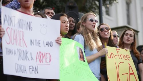 At a protest Tuesday, March 21, University of Georgia students gathered at the Arch to oppose the 2017 campus carry bill that passed the Legislature and is now on the governor's desk. (John Roark/ Athens Banner-Herald via AP)