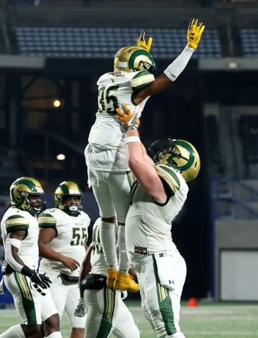 Dec. 30, 2020 - Atlanta, Ga: Grayson wide receiver Myles Woods (35) celebrates a rushing touchdown with offensive lineman Griffin Scroggs (70) in the first half against Collins Hill during the Class 7A state high school football final at Center Parc Stadium Wednesday, December 30, 2020 in Atlanta. JASON GETZ FOR THE ATLANTA JOURNAL-CONSTITUTION