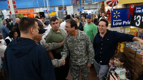 Clark Howard meeting fans at the Wal-Mart in Marietta near the Big Chicken during his toy drive for foster children on Sunday, December 13, 2015. CREDIT: Rodney Ho/ rho@ajc.com