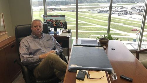 Atlanta Motor Speedway President Ed Clark sits above a quiet track Friday, soon after the Folds of Honor QuikTrip 500 was postponed because of the coronavirus outbreak. (Steve Hummer/AJC Photo)