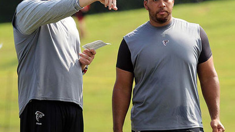 FILE PHOTO -- 110801 Flowery Branch - Offensive tackle Tyson Clabo, left, and offensive guard Justin Blalock, right, who just signed a contract with the Falcons, watch practice but are not yet able to participate while players run through the first padded practice at training camp in Flowery Branch on Monday, August 1, 2011. Curtis Compton ccompton@ajc.com FILE PHOTO -- 110801 Flowery Branch - Offensive tackle Tyson Clabo, left, and offensive guard Justin Blalock, right, who just signed a contract with the Falcons, watch practice but are not yet able to participate while players run through the first padded practice at training camp in Flowery Branch on Monday, August 1, 2011. Curtis Compton ccompton@ajc.com