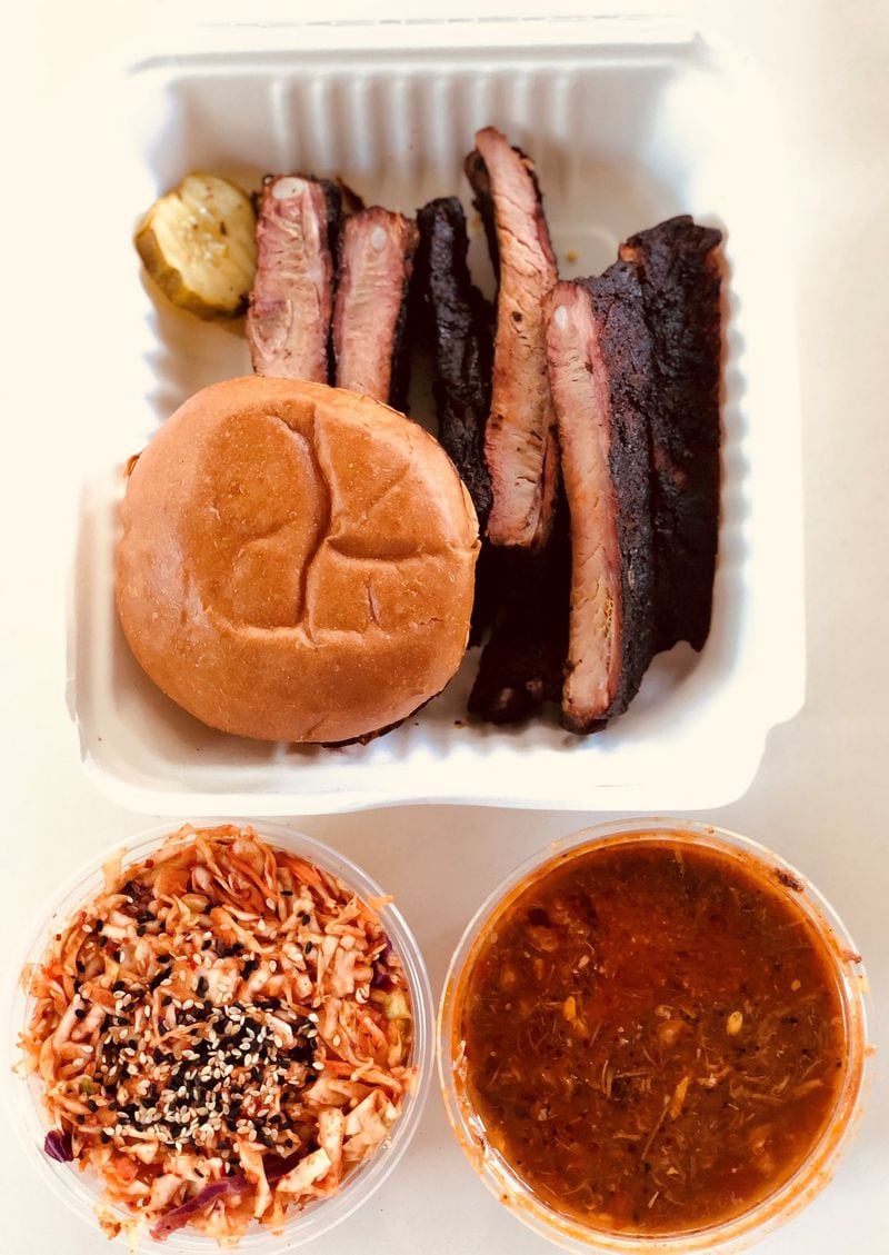 This takeout from Heirloom Market BBQ includes a half slab of ribs with spicy slaw and Brunswick stew. CONTRIBUTED BY WENDELL BROCK
