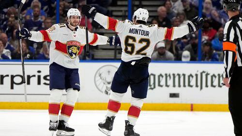 Florida Panthers defenseman Brandon Montour (62) celebrates his goal against the Tampa Bay Lightning with defenseman Oliver Ekman-Larsson (91) during the second period in Game 3 of an NHL hockey Stanley Cup first-round playoff series, Thursday, April 25, 2024, in Tampa, Fla. (AP Photo/Chris O'Meara)
