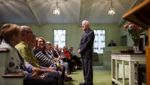Former President Jimmy Carter greets visitors before teaching a Sunday school class at Maranatha Baptist Church in Plains in April 2018. The former president, now 99, has been in hospice care since February 2023. “He is just the same remarkable man," said Paige Alexander, CEO of the Carter Center. "He has always been outliving and surprising us all.” (Melissa Golden/The New York Times)