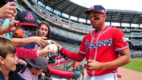 ATLANTA, GA - SEPTEMBER 10: Johan Camargo #17 of the Atlanta Braves signs autographs before the game against the Miami Marlins at SunTrust Park on September 10, 2017 in Atlanta, Georgia. (Photo by Scott Cunningham/Getty Images)