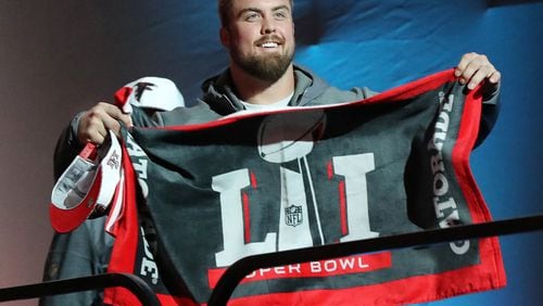January 30, 2017, Houston: Falcons guard Ben Garland flashes a Super Bowl towel as he takes the stage for Super Bowl Opening Night on Monday, Jan. 30, 2017, at Minute Maid Park in Houston. Curtis Compton/ccompton@ajc.com
