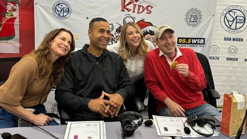 Lane Howard, Fred Blankenship, Rebecca Howard Jennings and Mark Arum pose at a local Wal-Mart durng the 33rd annual Clark's Christmas Kids event. KEN CHARLES