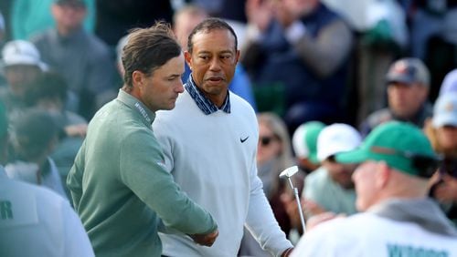 040922 Augusta: Tiger Woods, center, greets Kevin Kisner after their third round of the Masters at Augusta National Golf Club on Saturday, April 9, 2022, in Augusta. (Curtis Compton / Curtis.Compton@ajc.com)