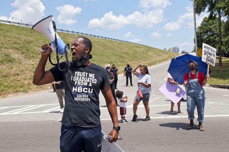 Protestors block University Avenue and the onramp to I-75 northbound near the Atlanta Wendy's where Rayshard Brooks, a 27-year-old black man,  was shot and killed by Atlanta police Friday evening during a struggle in a Wendy’s drive-thru line.  Steve Schaefer for the Atlanta Journal Constitution