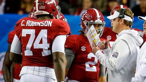 Alabama offensive coordinator Lane Kiffin talks with players during the first half of the Peach Bowl NCAA college football game against Washington, Saturday, Dec. 31, 2016, in Atlanta. (AP Photo/Butch Dill)