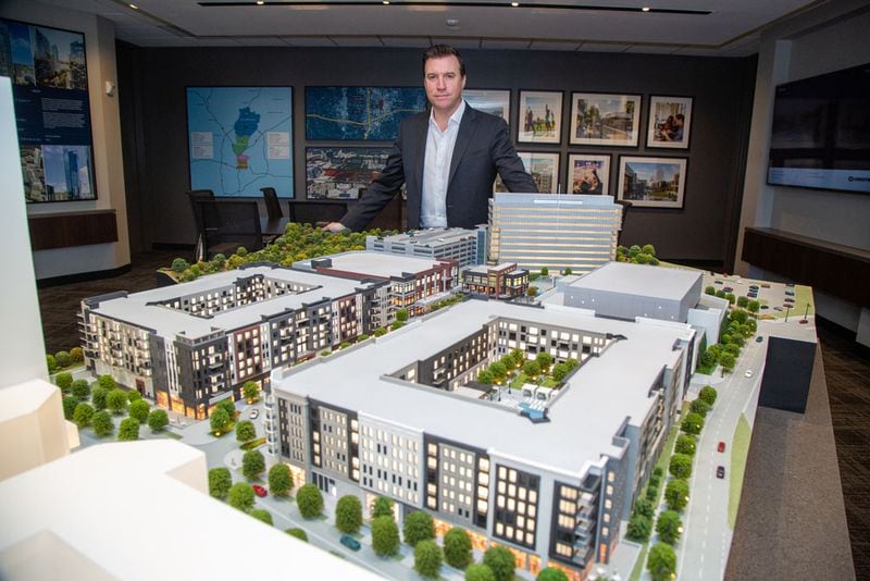 GID Development Group President James Linsley with a 3D rendering of phase one of the High Street project in Dunwoody.  (Photo by Phil Skinner)