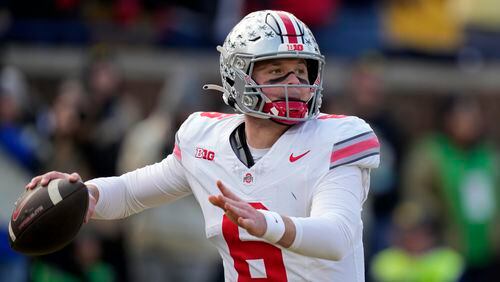 FILE - Ohio State quarterback Kyle McCord throws during the first half of an NCAA college football game against Michigan, Saturday, Nov. 25, 2023, in Ann Arbor, Mich. McCord went 11-1 as a starter with the Buckeyes and has looked polished throughout the spring.(AP Photo/Carlos Osorio, File)