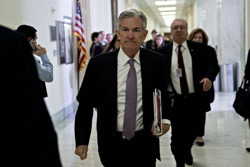 Federal Reserve Chairman Jerome Powell walking through the Rayburn House Office in Washington earlier this year. The Fed can exert enormous influence on the economy by raising short-term rates. (Bloomberg photo by Andrew Harrer)