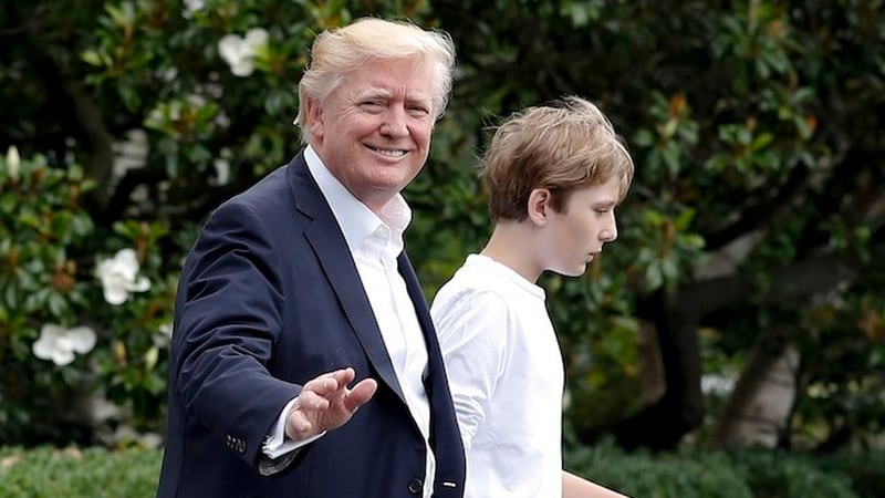 President Donald Trump and his son Barron Trump walk to Marine One across the South Lawn of the White House in Washington, Saturday, June 17, 2017, en route to Camp David in Maryland. (AP Photo/Carolyn Kaster)