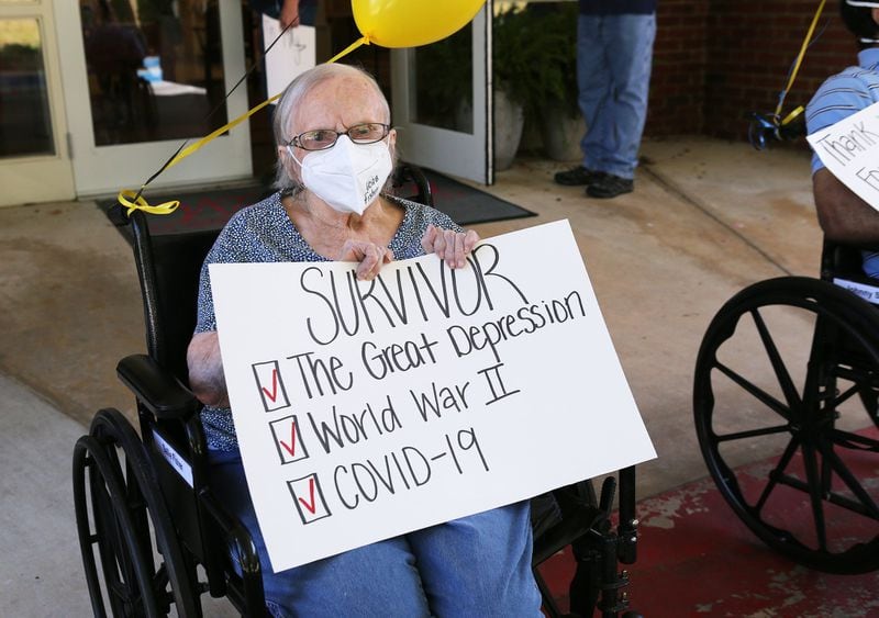 Westbury Medical Care & Rehabilitation resident Sallie Fisher, 96, joins in a celebration of the recovery outside the home. Westbury is one of the hardest hit nursing homes in Georgia with 20 deaths and more than 100 residents infected. The staff has also been hit hard with more than two dozen staff testing positive. Curtis Compton ccompton@ajc.com
