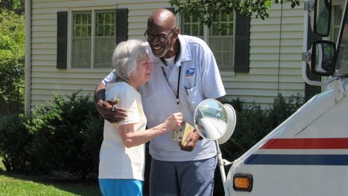 Floyd Martin delivered the mail, and so much more, during his nearly 35 years as a mailman. Lorraine Wascher was one of the many residents who waited for him during his last week, to say thank you. Photo: Jennifer Brett