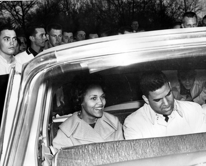 (Jan. 10, 1961) Athens, Ga.: - Charlayne Hunter and Hamilton Holmes have just entered their auto as they leave the University of Georgia campus after a trying day. They have completed all need qualifications for their entrance at the University of Georgia. Students stand around their car as the two smile with joy.
MANDATORY CREDIT: CHARLES PUGH / THE ATLANTA JOURNAL-CONSTITUTION