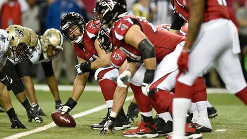 The Falcons' offensive line prepares for a play against the New Orleans Saints.