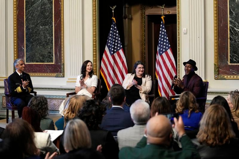Singer-songwriter Aloe Blacc, right, sings during an event on the White House complex in Washington, Tuesday, April 23, 2024, with notable suicide prevention advocates. He is joined by, from left, Surgeon General Dr. Vivek Murthy, Ashley Judd, and Shelby Rowe, Executive Director of the Suicide Prevention Research Center. The White House held the event on the day they released the 2024 National Strategy for Suicide Prevention to highlight efforts to tackle the mental health crisis and beat the overdose crisis. (AP Photo/Susan Walsh)
