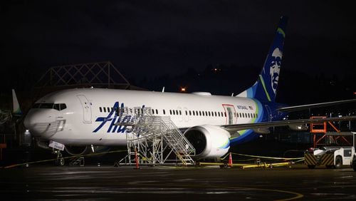 A plastic sheet covers an area of the fuselage of the Alaska Airlines N704AL Boeing 737 MAX 9 aircraft outside a hangar at Portland International Airport on Jan. 8, 2024, in Portland, Oregon, following a midair fuselage blowout on Jan. 5. None of the 171 passengers and six crew members were seriously injured. (Mathieu Lewis-Rolland/Getty Images/TNS)