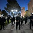 Police stage on the UCLA campus near an encampment set up by pro-Palestinian demonstrators Wednesday, May 1, 2024, in Los Angeles. (AP Photo/Ryan Sun)