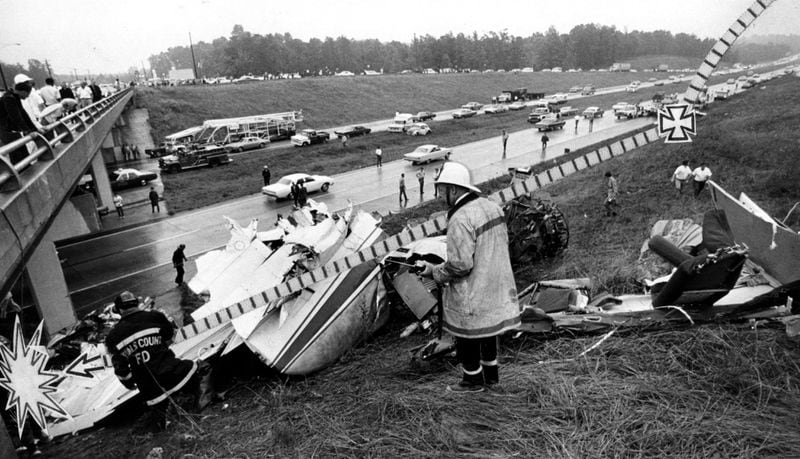 May 30, 1970 -- Six persons died and 30 others were injured when a twin-engine private plane, Lehigh Acres Development Inc. Flight 701, crashed on a bridge over I-285 in Atlanta. The line on the photo charts the plane's path as it hit the car on the interstate, bounced and skidded into the ramp of the Moreland Ave. bridge. The victims' car is visible above the cross at right, the aircraft's tail section, an engine and a wing are near the point of impact. Read the 1970 NTSB crash report (.PDF format) | Latest news on Malaysia Airlines Flight 370