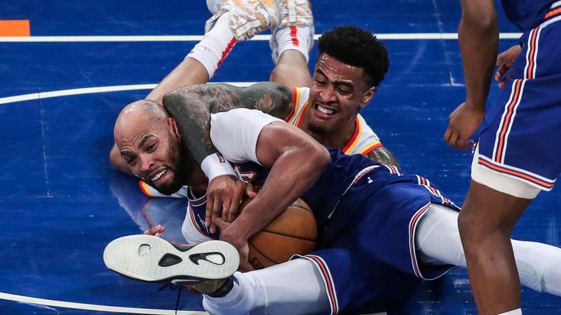 New York Knicks center Taj Gibson, left, and Atlanta Hawks forward John Collins (20) fight for a loose ball during the third quarter of Game 5 of an NBA basketball first-round playoff series Wednesday, June 2, 2021, in New York. (Wendell Cruz/Pool Photo via AP)