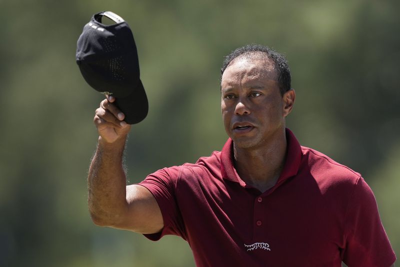 Tiger Woods waves after his final round at the Masters golf tournament at Augusta National Golf Club Sunday, April 14, 2024, in Augusta, Ga. (AP Photo/David J. Phillip)