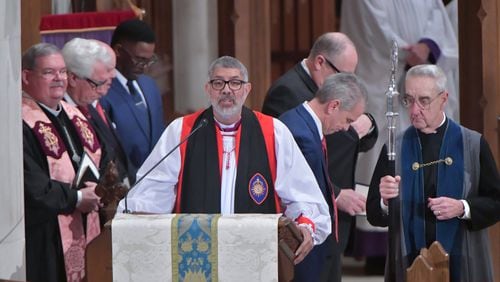 Bishop Robert Wright of the Episcopal Diocese of Atlanta, shown at an Inauguration Day prayer service in 2019, said churches can cancel all worship services for the next two weeks or practice extreme caution amid the coronavirus threat. HYOSUB SHIN / HSHIN@AJC.COM