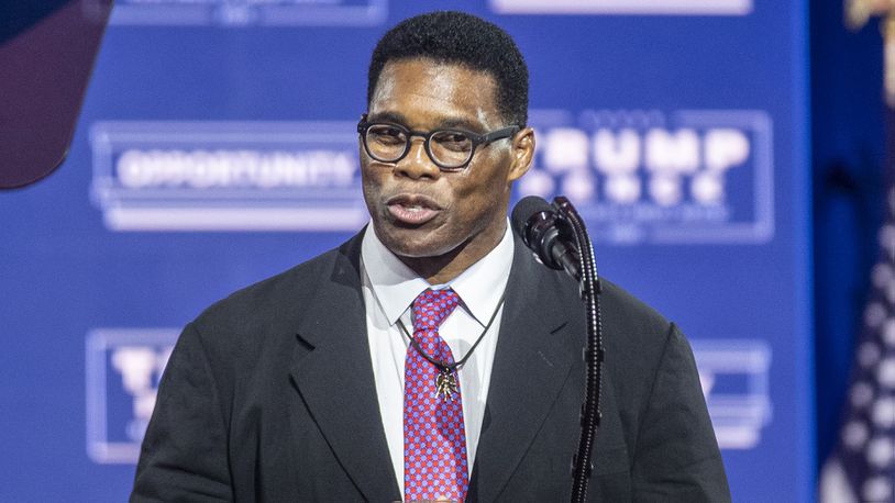Former professional football player Herschel Walker speaks to the crowd before introducing President Donald Trump during a Blacks for Trump campaign rally at the Cobb Galleria Centre in Atlanta, Friday, September 25, 2020.  (Alyssa Pointer / Alyssa.Pointer@ajc.com)