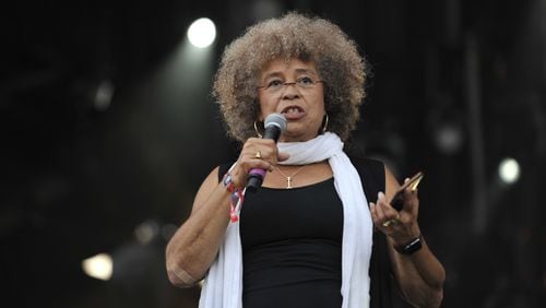 Angela Davis speaks at the Many Rivers to Cross Music and Arts Festival in Fairburn on Oct. 1, 2016. Social justice was one of the festival’s themes. DAVID BARNES / SPECIAL TO AJC