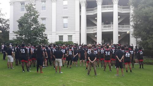 Georgia football players gather in front of the Holmes-Hunter Academic Building on the lawn of UGA's North Campus to hear a speech about racial inequality. (Photo from UGA)
