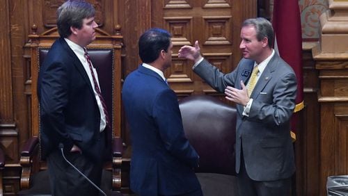 June 23, 2020 Atlanta - From left, Chief of Staff for Lt. Governor Duncan, John Porter, Lieutenant Governor Geoff Duncan and Sen. John Albers (R-Roswell) confer in the Senate Chambers on day 37 of the legislative session at Georgia State Capitol on Tuesday, June 23, 2020. (Hyosub Shin / Hyosub.Shin@ajc.com)