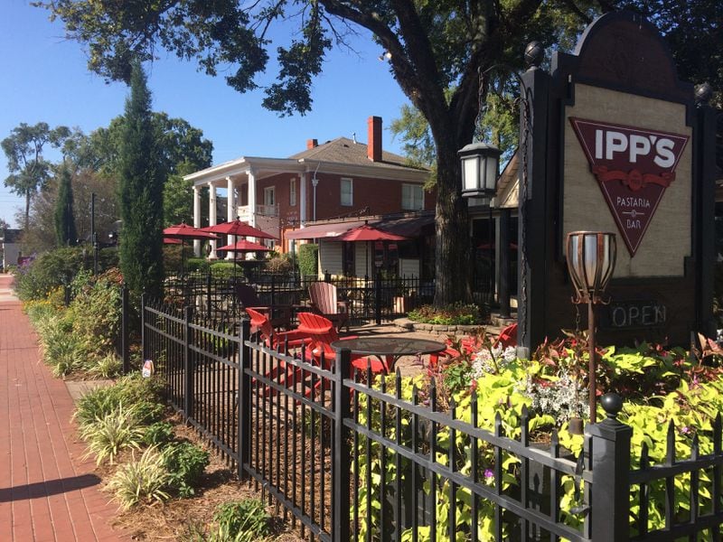 Main Street in Woodstock is lined with quaint and cool places to eat and shop, some of them in well-preserved old houses and buildings. Ipps Pastaria is a popular Italian dining spot. (Jill Vejnoska/AJC)